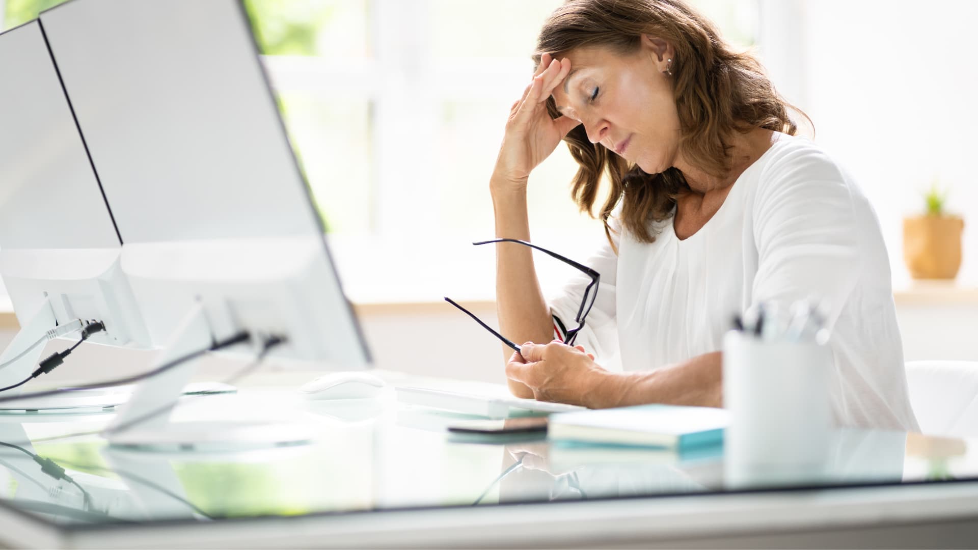 Woman stressed at her desk