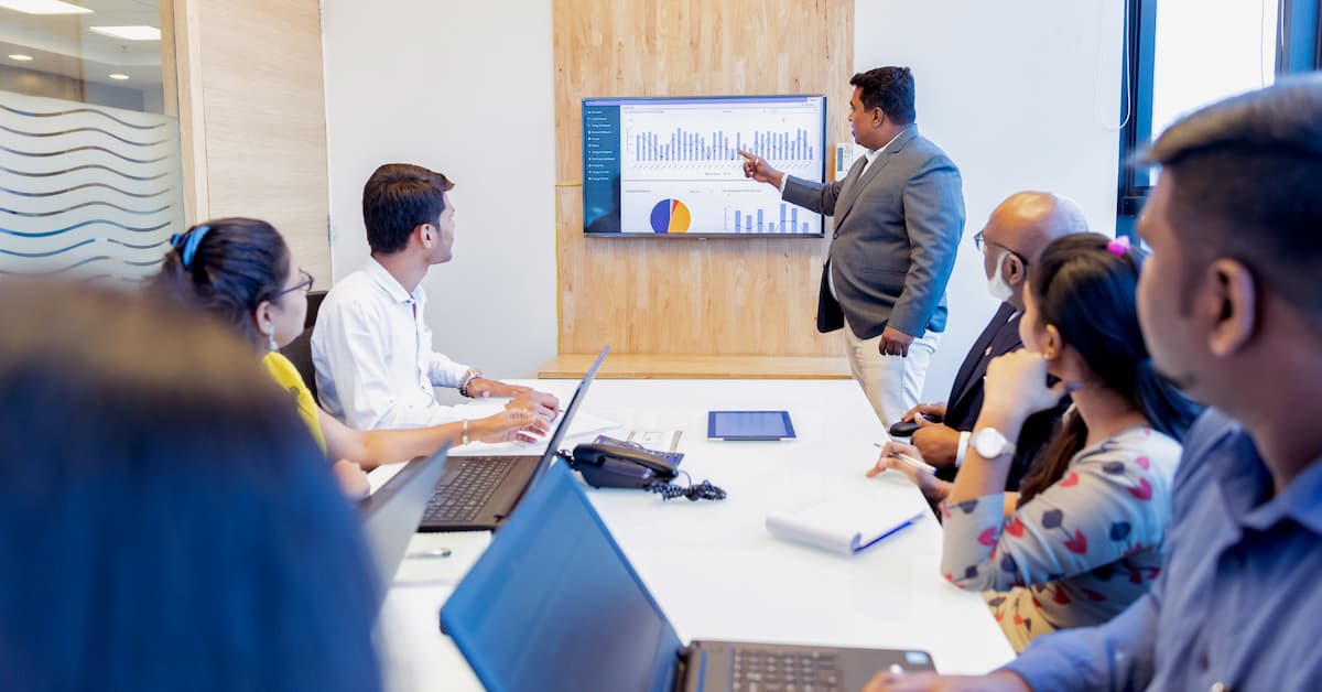 What Is a CFO and Does My Small Business Really Need One_ (Banner Photo) Business meeting with data presentation