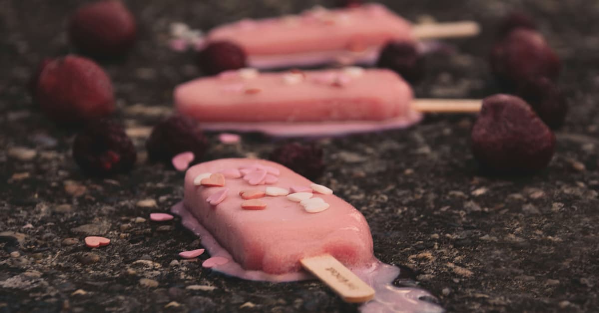 Melting pink popsicles with flowers